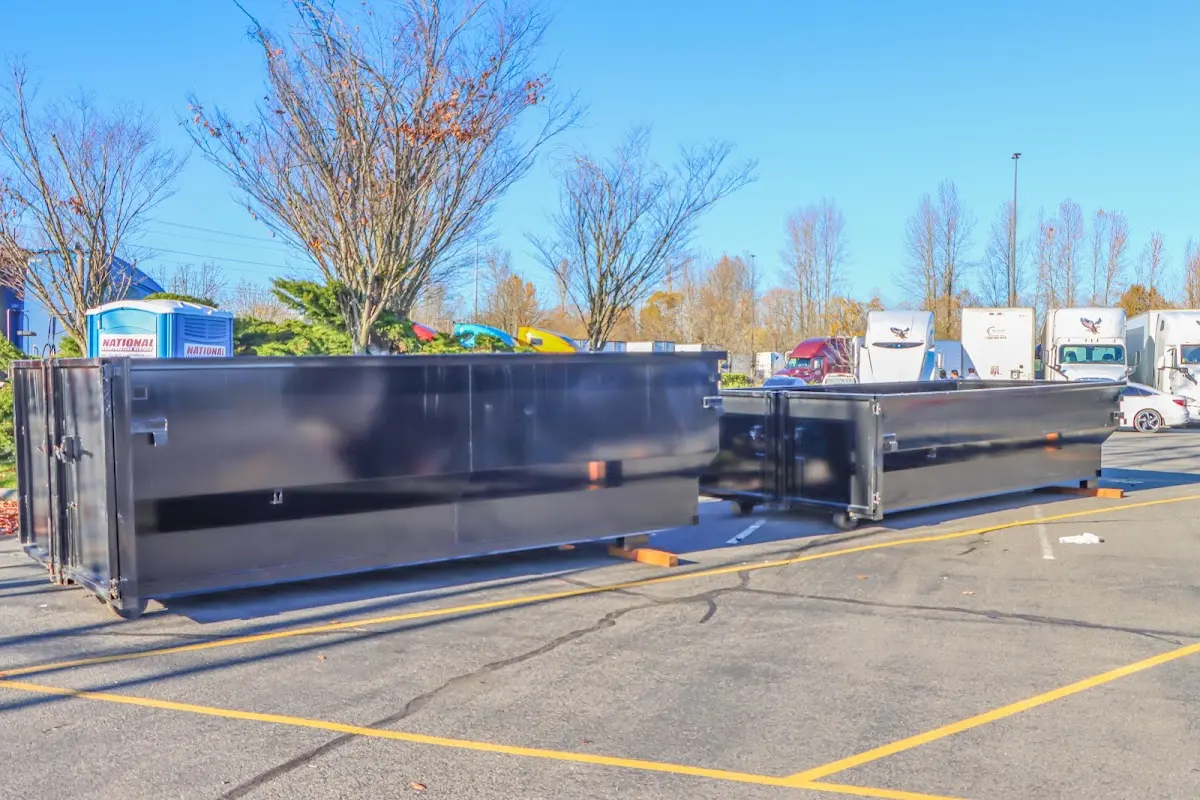 Professional dumpster rental service with roll-off container on residential driveway in Thousand Oaks